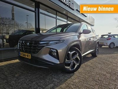 Bruin Occasion 2022 Hyundai Tucson Premium SUV | € 30.645 (Eerlijke prijs)