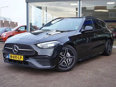 Zwart Occasion 2021 Mercedes C200 AMG line Stationwagen | € 29.950 (Iets duurder)