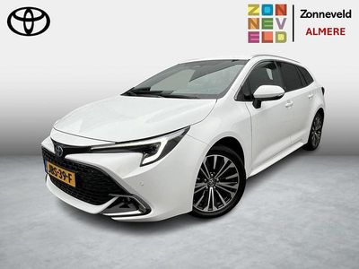 Wit Gebruikt 2024 Toyota Corolla Hybrid Premium Stationwagen | € 33.799