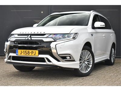 tweedehands Mitsubishi Outlander 2.4 PHEV Intense S | Trekhaak | Half-leder | Allseason | 4WD | Achteruitrijcamera | Stoelverwarming | Navigatie | Climate Contro