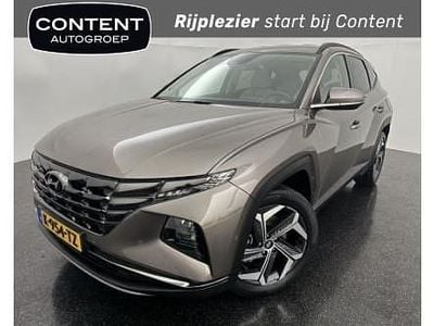 Bruin metallic Occasion 2021 Hyundai Tucson Premium SUV | € 29.490 (Eerlijke prijs)