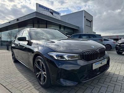 tweedehands BMW 320e 3-SERIE TouringM sport NEW MODEL aut pano/dak. head up, memory stoelen, blacl pack, etc .