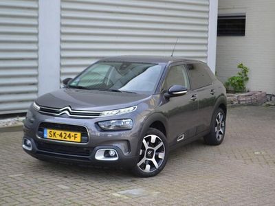 tweedehands Citroën C4 Cactus 1.2 PureTech Shine I 130PK I PDC VOOR & ACHTER I STARTKNOP I ACHTERUITRIJCAMERA I KEYLESS ENTRY I COMFORT SEATS I COMFORT VERING I ZOMERBANDEN L.M. VELGEN + WINTERBANDEN OP L.M. VELGEN I