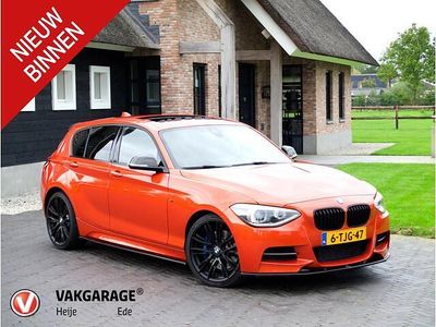 Oranje Occasion 2013 BMW M135 Executive Hatchback | € 21.995 (Duur)