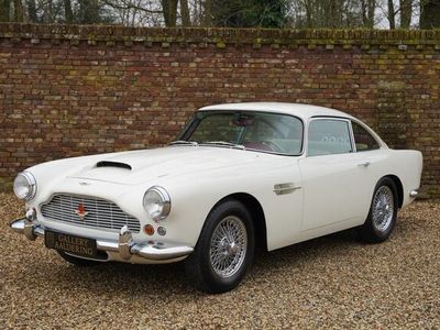 tweedehands Aston Martin DB4 Series 3 Full restored by Works Service in the UK, Extensive restoration-report with photos, Original left-hand drive model, Executed in Dover White over Magnolia with Oxblood piping, Fitted with the high performance 'Special