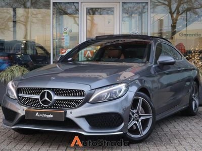 Grijs (metallic) Gebruikt 2018 Mercedes C180 AMG line Coupé | € 23.700 (Goede deal)