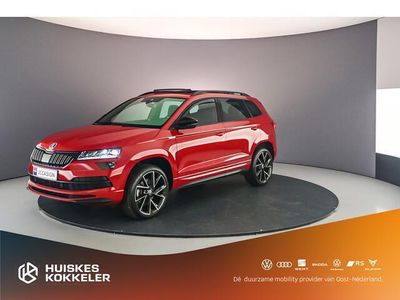 tweedehands Skoda Karoq Sportline Business 1.5 TSI 150pk DSG Automaat Panoramadak, Elektrische achterklep, Navigatie, Achteruitrijcamera, Cruise control, Airco, Parkeersensoren, Verwarmde voorruit, Stoelverwarming