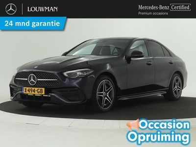 tweedehands Mercedes C300e AMG | Elektrisch wegklapbare trekhaak | Dodehoeksensoren | Elektrische stoelen met memory | Stoelverwarming | Sfeerverlichting | Inclusief 24 MB Certified garantie voor Europa