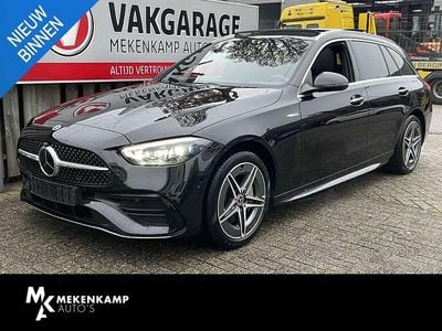 Zwart Gebruikt 2022 Mercedes C300e AMG line Stationwagen | € 39.950 (Eerlijke prijs)
