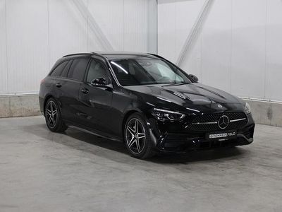 Zwart (metallic) Gebruikt 2023 Mercedes C220 AMG line Stationwagen | € 54.995