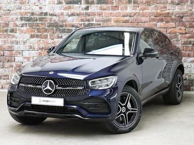 Blauw (metallic) Occasion 2021 Mercedes GLC300 AMG line Coupé | € 47.945 (Super prijs)