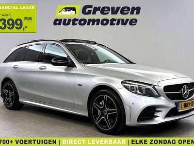 Zilver (metallic) Occasion 2021 Mercedes C300e AMG Stationwagen | € 25.000 (Eerlijke prijs)