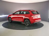 tweedehands Skoda Karoq Sportline Business 1.5 TSI 150pk DSG Automaat Panoramadak, Elektrische achterklep, Navigatie, Achteruitrijcamera, Cruise control, Airco, Parkeersensoren, Verwarmde voorruit, Stoelverwarming