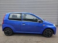 Occasion Daihatsu Cuore 59 PK (43 kW) 2008 Blauw, metallic lak Hatchback