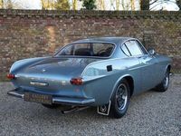 tweedehands Volvo P1800 P1800Livery in Steel Blue Metallic over black leather upholstery, 4 Speed gearbox with overdrive, 1 Owner from 2008 till 2024, Swiss "Abgas-Wartungsdokument" with mileage registration, Known at Gallery Aaldering in the workshop for regular m