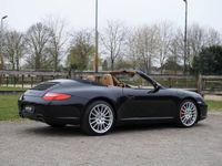 tweedehands Porsche 911 Carrera Cabriolet 3.6 Carrera |Motor gereviseerd |325 pk |Tiptronic S |2e eigenaar |Leder |Bose |Xenon |Verwarmde stoelen |Zwart metallic |Sportstuur |19" LM-velgen |Cruise |Airco |P-sensoren |997