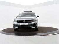 tweedehands VW Tiguan Allspace 1.5 Tsi 150pk DSG R-Line Business 7p. | Climatronic | Pano | Keyless | Camera | Navi | ACC | App-Connect | Trekhaak | 19'' Inch | Garantie t/m 30-05-2027 of 100.000km