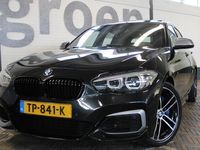 tweedehands BMW M140 1-SERIEEdition Shadow High Executive | 340 PK | Harman / Kardon | Apple CarPlay | Schuif / kantel dak | Vol lederen memory sportstoelen met verwarming | Cruise | Clima | Nederlands geleverde | LED kolampen | Lane en bots assist |