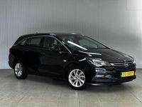 tweedehands Opel Astra Sports Tourer 1.4 Business Executive /150PK! /Apple + Android /KEYLESS! /Trekhaak /DAB+! /Navi /Climat /Cruise /Elek. pakket /Bluetooth /Regensensor /16"LMV /PDC V+A /LED Dagrijverl. /Chroom.