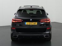 tweedehands BMW X5 xDrive45e High Executive | M-Sport Pakket | NL Auto | Laser Licht | Harman/Kardon | Comfortstoelen + Geheugen | Navigatie | Panoramadak | Luxe lederen bekleding | LED | DAB | CraftedClarity | 22" Lichtmetaal | HUD |