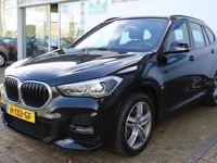 tweedehands BMW X1 sDrive18i High Executive Edition M-pakket | Incl. 1 jaar Garantie | Panorama dak | Elektrische kofferbak | Climate controle | Stoelverwarming | Parkeersensoren V+A | Navigatie | Cruise controle | Lederen bekleding | Harman/Kardon audiosysteem | Hea