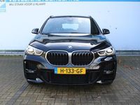 tweedehands BMW X1 sDrive18i High Executive Edition M-pakket | Incl. 1 jaar Garantie | Panorama dak | Elektrische kofferbak | Climate controle | Stoelverwarming | Parkeersensoren V+A | Navigatie | Cruise controle | Lederen bekleding | Harman/Kardon audiosysteem | Hea