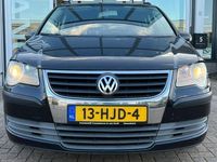 tweedehands VW Touran 1.6 7-persoons navigatie airco cruise controle lm-velgen elektrische pakket trekhaak