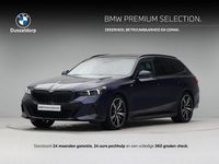 Occasion BMW 550e M Sport 489 PK (359 kW) 2024 Blauw Stationwagen