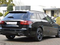 Occasion Mercedes C180 AMG line 157 PK (115 kW) 2021 Zwart Stationwagen