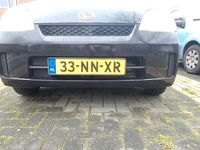 Occasion Daihatsu Cuore 58 PK (42 kW) 2004 Zwart Hatchback