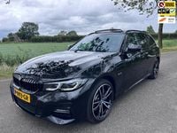 Occasion BMW 330e Executive 184 PK (135 kW) 2022 Zwart Stationwagen