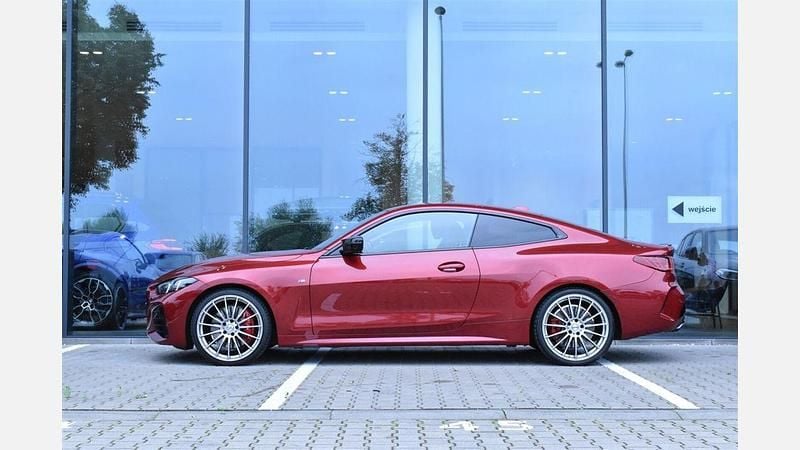 Używany BMW M440 Comfort Edition 340 KM (250 kW) 2024 Czerwony fire red metalizowany Sedan/Limuzyna