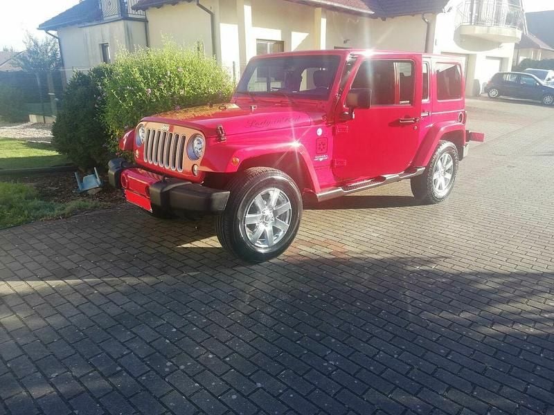 Czerwony Używany 2017 Jeep Wrangler Sahara SUV | 110 000 zł (Dobra cena) - Obraz 1/4