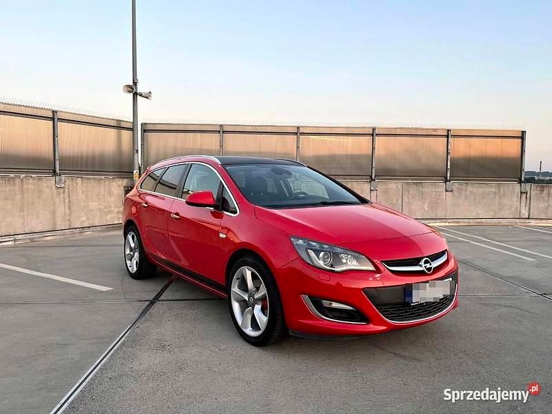 Czerwony Używany 2013 Opel Astra OPC Kombi | 23 750 zł (Uczciwa cena) - Obraz 1/4