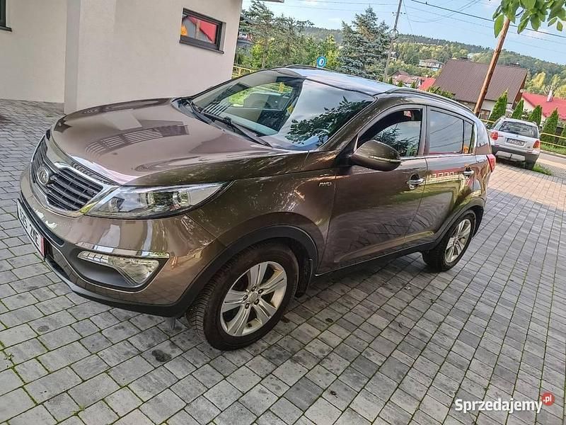 Brązowy Używany 2012 Kia Sportage SUV | 34 900 zł (Uczciwa cena) - Obraz 1/4