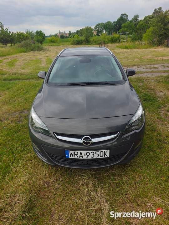 Szary Używany 2015 Opel Astra Active Kombi | 29 990 zł (Uczciwa cena) - Obraz 1/4