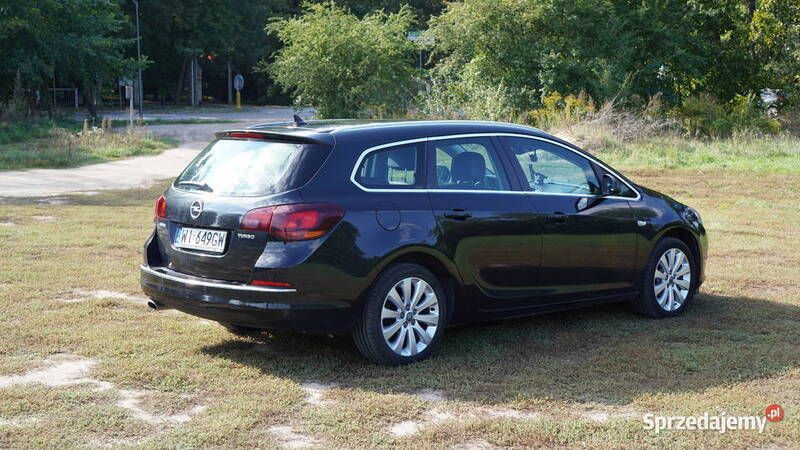 Czarny Używany 2014 Opel Astra Cosmo Kombi | 35 900 zł (Dość drogi) - Obraz 1/4