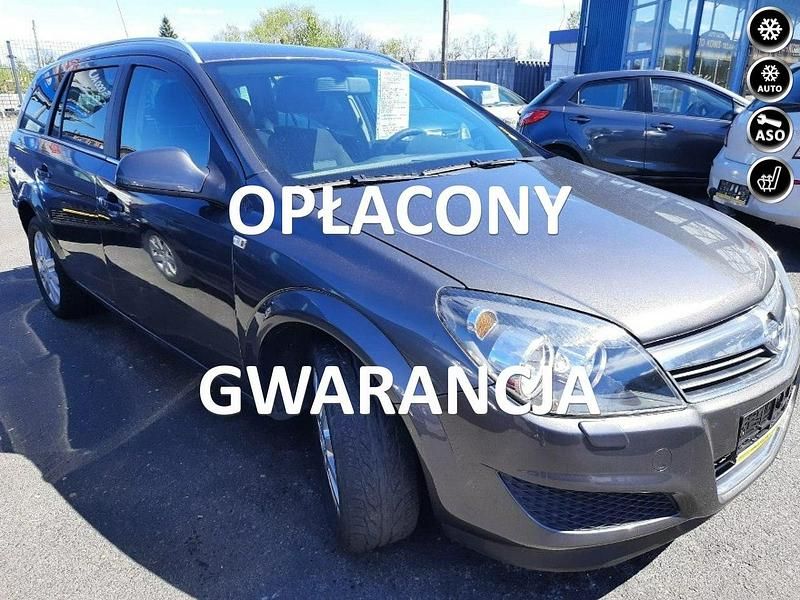 Szary Używany 2011 Opel Astra Kombi | 18 900 zł (Uczciwa cena) - Obraz 1/4