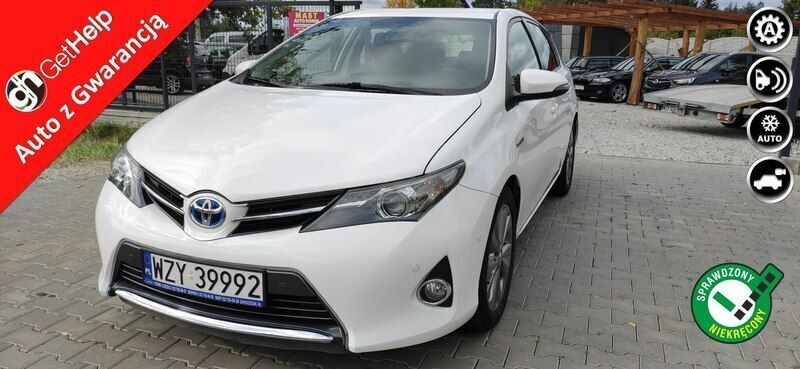 Biały Używany 2013 Toyota Auris Hybrid Hatchback | 43 999 zł (Uczciwa cena) - Obraz 1/4