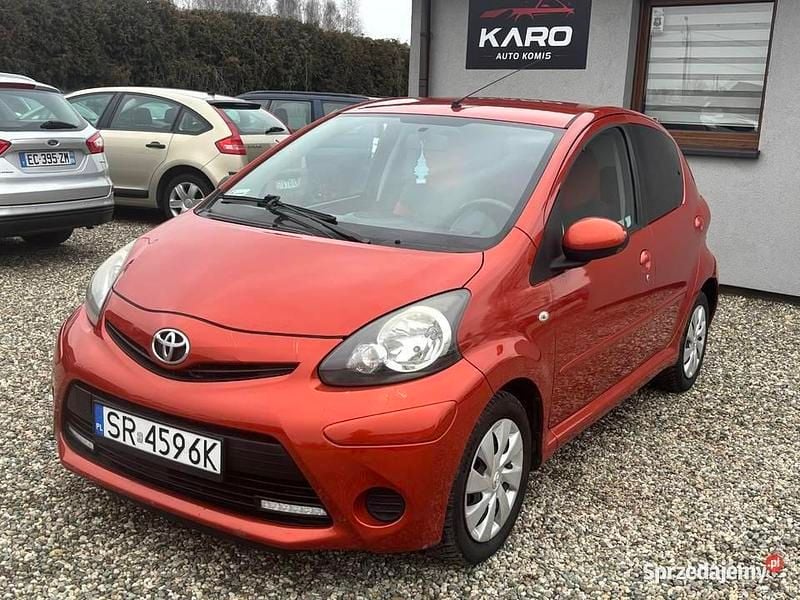 Pomarańczowy Używany 2012 Toyota Aygo Hatchback | 18 490 zł (Uczciwa cena) - Obraz 1/4