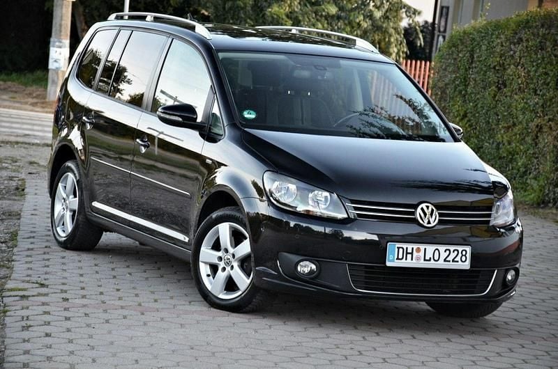 Czarny (metalik, perła) Używany 2012 VW Touran Minivan | 31 900 zł (Uczciwa cena) - Obraz 1/4