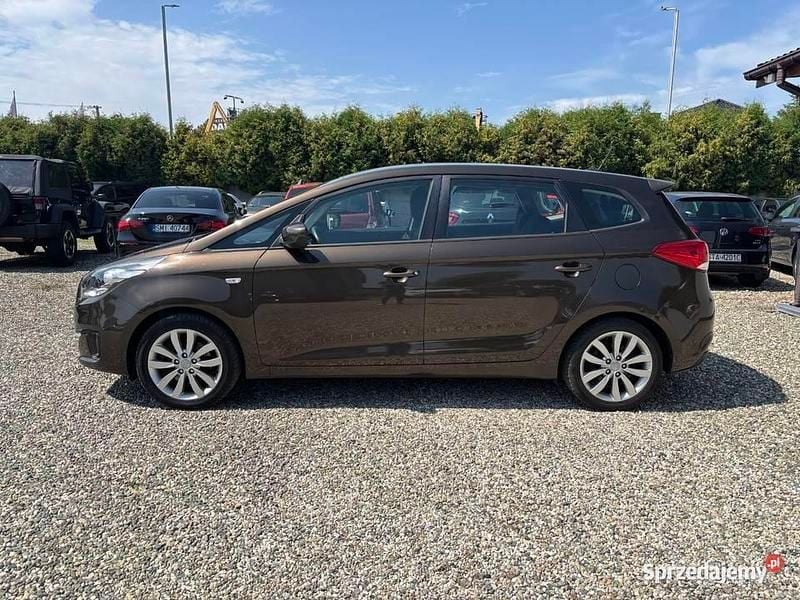 Brązowy Używany 2013 Kia Carens 2 Minivan | 35 990 zł (Dość drogi) - Obraz 1/4