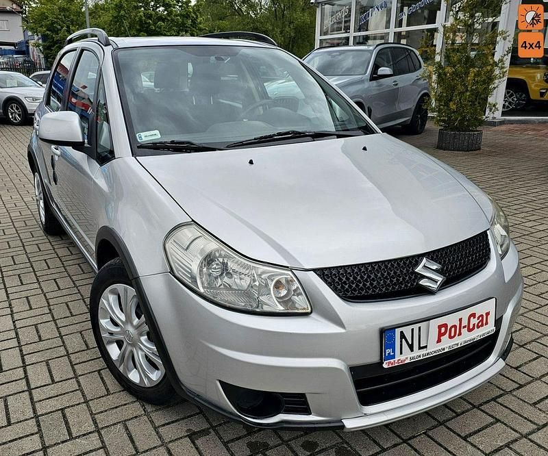 Srebrny (metalik) Używany 2012 Suzuki SX4 SUV | 24 900 zł - Obraz 1/4
