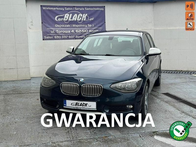 Granatowy Używany 2013 BMW 118 Comfort Edition Hatchback | 29 890 zł - Obraz 1/4