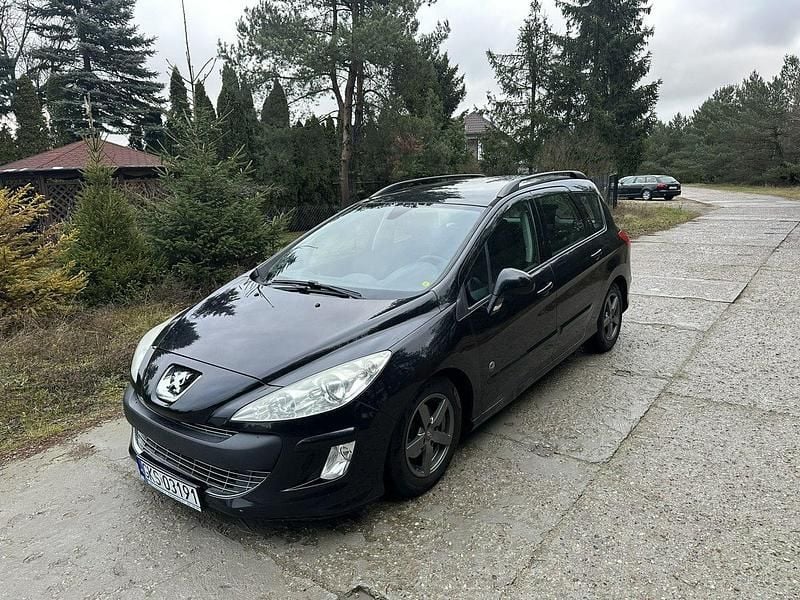 Używany Peugeot 308 SW 120 KM (88 kW) 2011 Czarny (metalik) Kombi