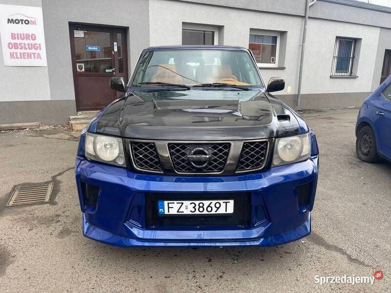 Fioletowy Używany 2014 Nissan Patrol SUV | 60 000 zł - Obraz 1/4