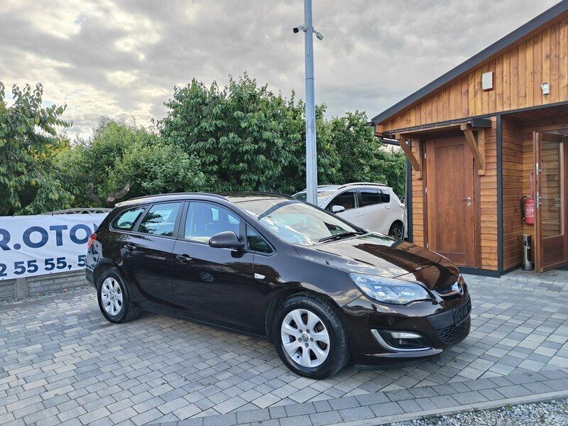 Bordowy (metalik) Używany 2013 Opel Astra Kombi | 23 800 zł (Uczciwa cena) - Obraz 1/2