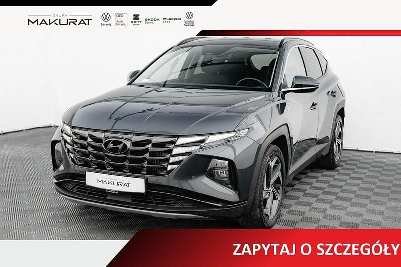Szary Używany 2022 Hyundai Tucson SUV | 107 850 zł (Uczciwa cena) - Obraz 1/4