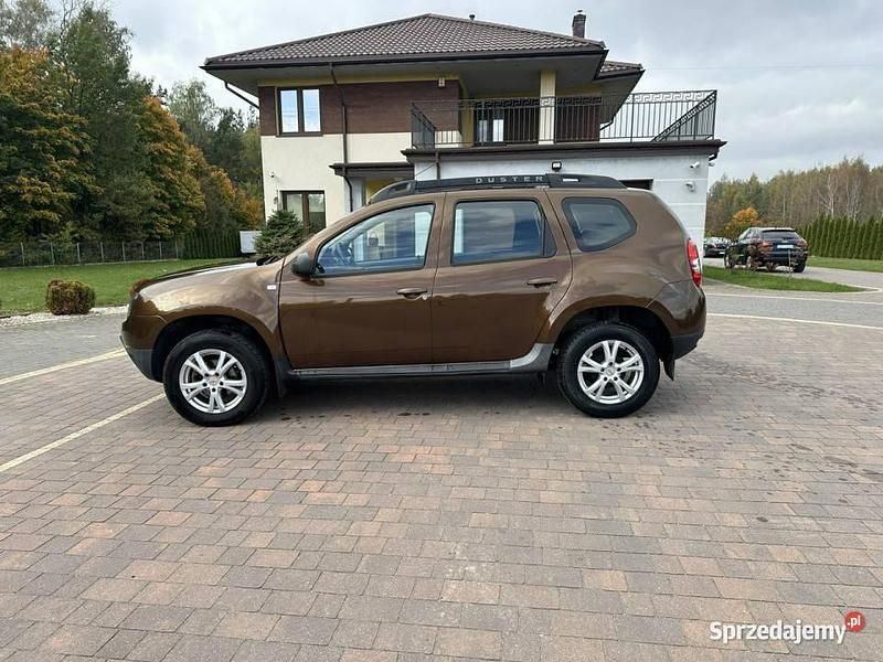 Używany Dacia Duster 125 KM (91 kW) 2015 Brązowobeżowy SUV