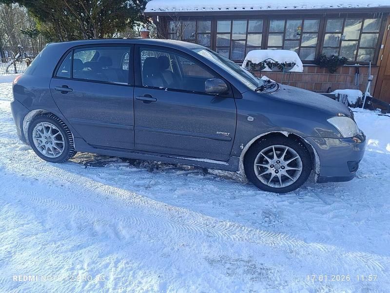 Używany Toyota Corolla 2006 Brązowobeżowy Hatchback